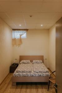 Ένα ή περισσότερα κρεβάτια σε δωμάτιο στο Guest house Baltika