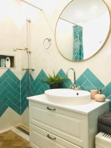 a bathroom with a sink and a mirror at Rab,new Apartman in Rab