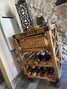 a cart with bottles of wine in a room at Cornerstone House in Pickering