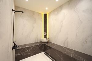 a bathroom with a black and white marble wall at Mula Hotel in Istanbul +73 photos