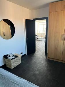 a room with a room with a mirror and a door at Designer apartment in Charlottenlund