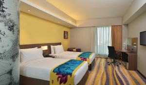 Postel nebo postele na pokoji v ubytování Fairfield by Marriott Ahmedabad