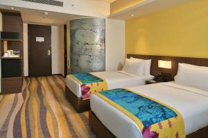Postel nebo postele na pokoji v ubytování Fairfield by Marriott Ahmedabad