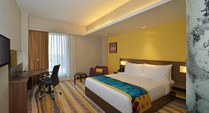 TV a/nebo společenská místnost v ubytování Fairfield by Marriott Ahmedabad