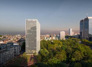a tall white building in the middle of a city at The Hoxton, Brussels in Brussels