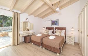 Ένα ή περισσότερα κρεβάτια σε δωμάτιο στο Villa Strati