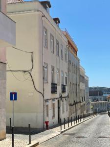 a row of buildings on the side of a street at BELEM PLACE - free parking area in Lisbon