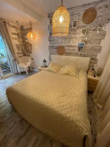 a bedroom with a bed and a wooden wall at Residencial Bajo con jardín y jacuzzi privado Calahonda Royale in Cabopino +64 photos