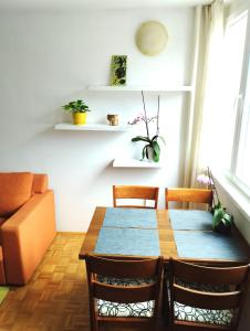 a dining room with a table and chairs at Apartman Amigo-Free public parking in Sarajevo