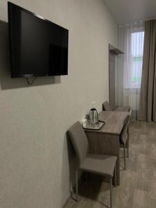 TV a/nebo společenská místnost v ubytování Hotel Voyage Вояж