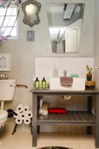 a bathroom with a sink and a toilet at The Khaya Accommodation for the Soul in Lorraine