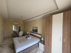 a bedroom with a bed and a bathroom at Azure W B&B in San Lawrenz