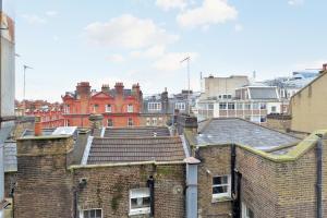 a view of roofs of buildings in a city at Chiltern Street Serviced Apartments by Globe Apartments in London