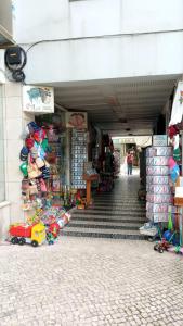 a store with a toy train in front of a building at Casa da Dona Palmira in Fátima