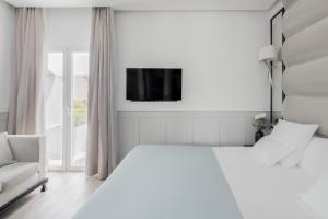 Posteľ alebo postele v izbe v ubytovaní Hotel MiM Ibiza & Spa - Adults Only