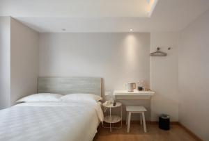 Voodi või voodid majutusasutuse Ole Tai Sam Un Hotel toas