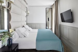 Posteľ alebo postele v izbe v ubytovaní Hotel MiM Ibiza & Spa - Adults Only