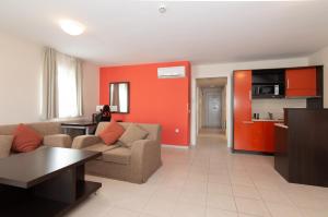 a living room with a couch and a table at Residence Marina Garbin Apartment in Portorož