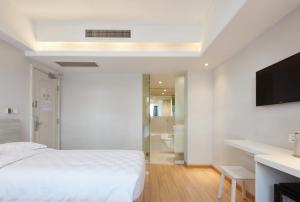 Voodi või voodid majutusasutuse Ole Tai Sam Un Hotel toas