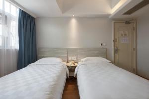 Voodi või voodid majutusasutuse Ole Tai Sam Un Hotel toas