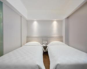 Voodi või voodid majutusasutuse Ole Tai Sam Un Hotel toas