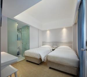 Voodi või voodid majutusasutuse Ole Tai Sam Un Hotel toas