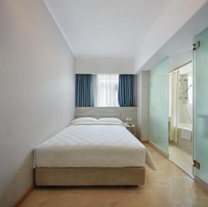 Voodi või voodid majutusasutuse Ole Tai Sam Un Hotel toas