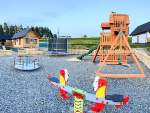 a playground with a play set and a slide at Wierchy Beskidu in Dobra