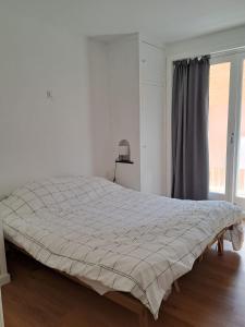 En eller flere senge i et værelse på Casa Cécile