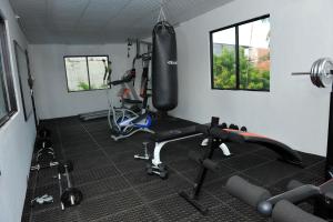 a room with a gym with exercise equipment in it at Nelly Star Hotel in Vavuniya