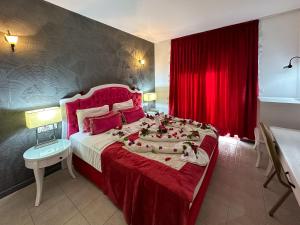 A bed or beds in a room at Tiana Beach Resort