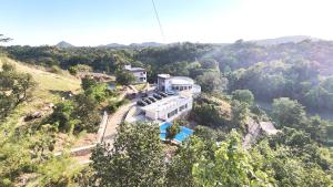 an aerial view of a house on a hill at The Sky Imperial Pavoreal Jungle Resort in Kumbhalgarh