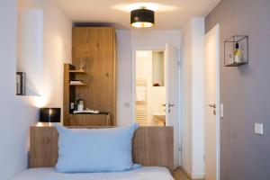 Voodi või voodid majutusasutuse Genusshotel Krone & Roadtrips bei Basel toas