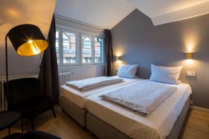 Voodi või voodid majutusasutuse Genusshotel Krone & Roadtrips bei Basel toas