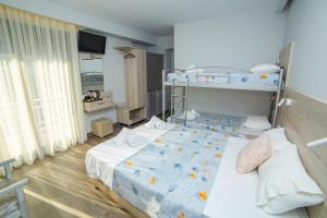 Postel nebo postele na pokoji v ubytování Hotel Zefyros