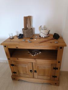 a wooden cabinet with a tea kettle on top at Morada del Mar in Palomares +28 photos