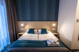 Postel nebo postele na pokoji v ubytování Hotel Zatoka + 37 fotografií