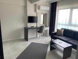 TV a/nebo společenská místnost v ubytování JK BUSINESS HOTEL
