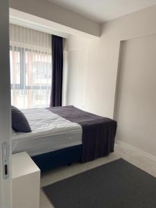 Postel nebo postele na pokoji v ubytování JK BUSINESS HOTEL + 37 fotografií