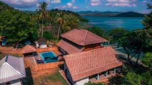an aerial view of a house with a swimming pool at Khabita Beach Resort in Lembar