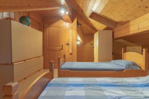Postel nebo postele na pokoji v ubytování Casa ai Tre Colli, Tres
