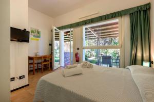 A bed or beds in a room at Residence Le Vele