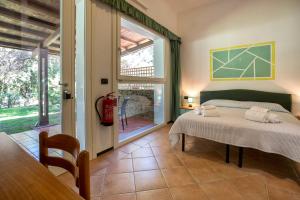 A bed or beds in a room at Residence Le Vele