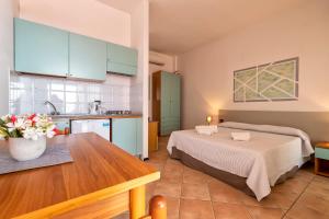A bed or beds in a room at Residence Le Vele