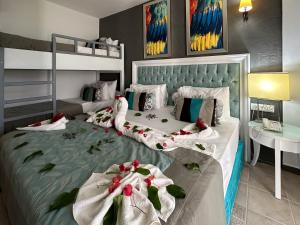 A bed or beds in a room at Tiana Beach Resort