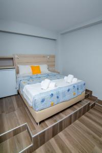 Postel nebo postele na pokoji v ubytování Hotel Zefyros