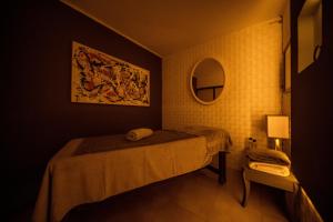 A bed or beds in a room at Tiana Beach Resort