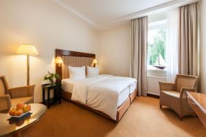 Postel nebo postele na pokoji v ubytování Hotel Birke, Ringhotel Kiel