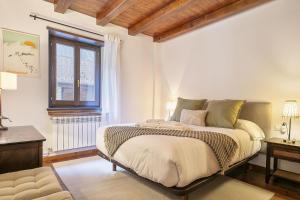 Кровать или кровати в номере Luderna - Apartamento Centelha