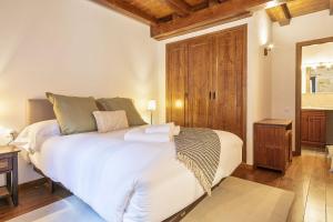 Posteľ alebo postele v izbe v ubytovaní Luderna - Apartamento Centelha